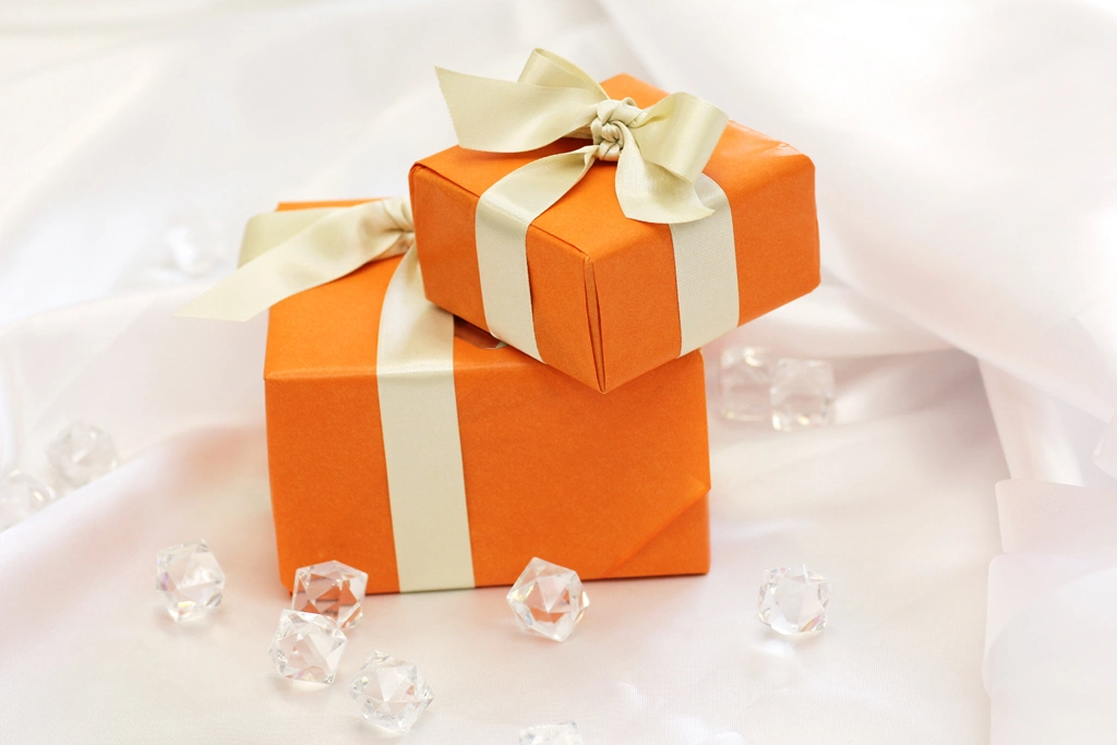 Two Orange Gift Boxes and Glass Cubes Photo