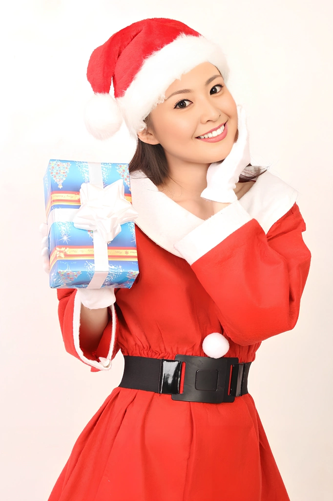 Portrait of an Asian Woman in a Santa Claus Costume with Her Hand on Her Chin #1, Photo