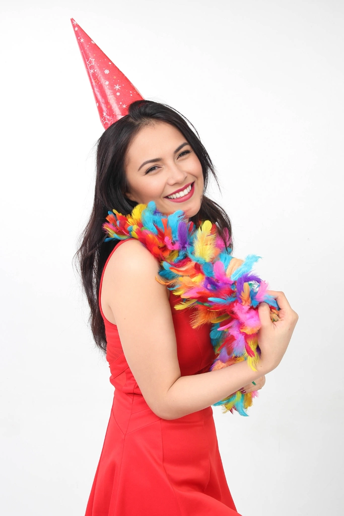 Ser of 5 Portrait Photos of a Woman Wearing a Party Hat and a Feather Shawl Around Her Neck | Woman #1 （face change by AI）